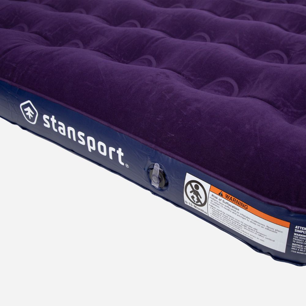 Purple inflatable mattress with 'stansport' branding on a white background
