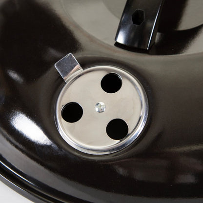 Close-up of a black car wheel with a silver rim cap.