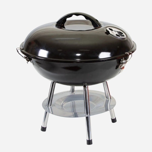 Black barbecue grill with a shiny surface on a white background