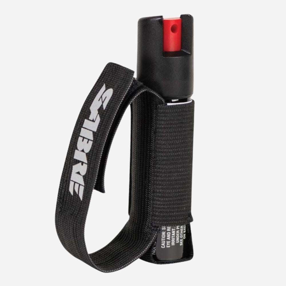 Black pepper spray with a strap on a white background