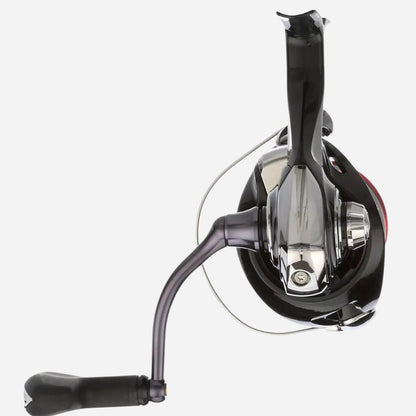 Fishing reel with black handle and metallic body on a white background