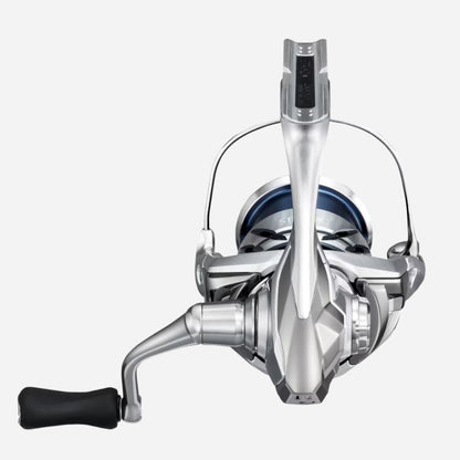 Fishing reel with metallic finish on a white background