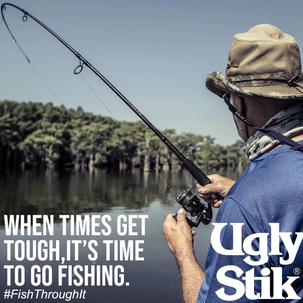 Person fishing with a quote about tough times and fishing, featuring Ugly Stik brand.