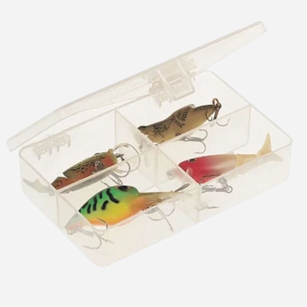 Set of colorful fishing lures in a clear box on a white background
