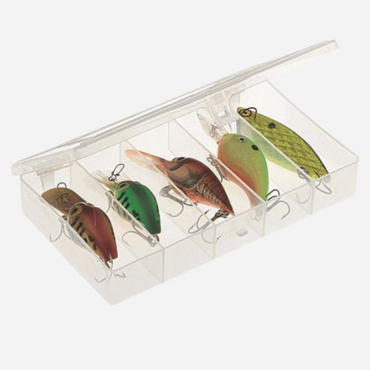 Set of colorful fishing lures in a clear box on a white background