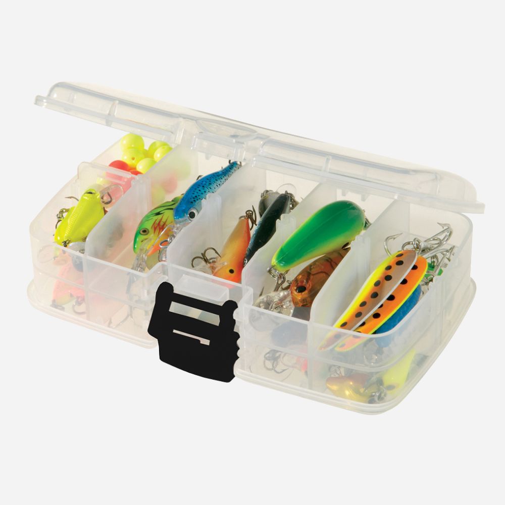 Clear tackle box with various fishing lures on a white background
