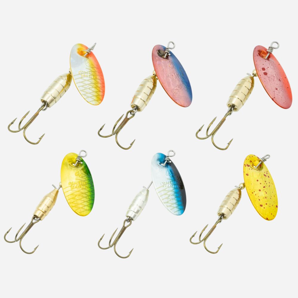 Assorted inline spinner fishing lures with colorful blades and treble hooks on white background