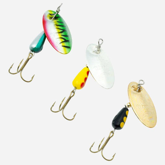 Panther Martin inline spinner fishing lures with colorful blades and treble hooks on white background