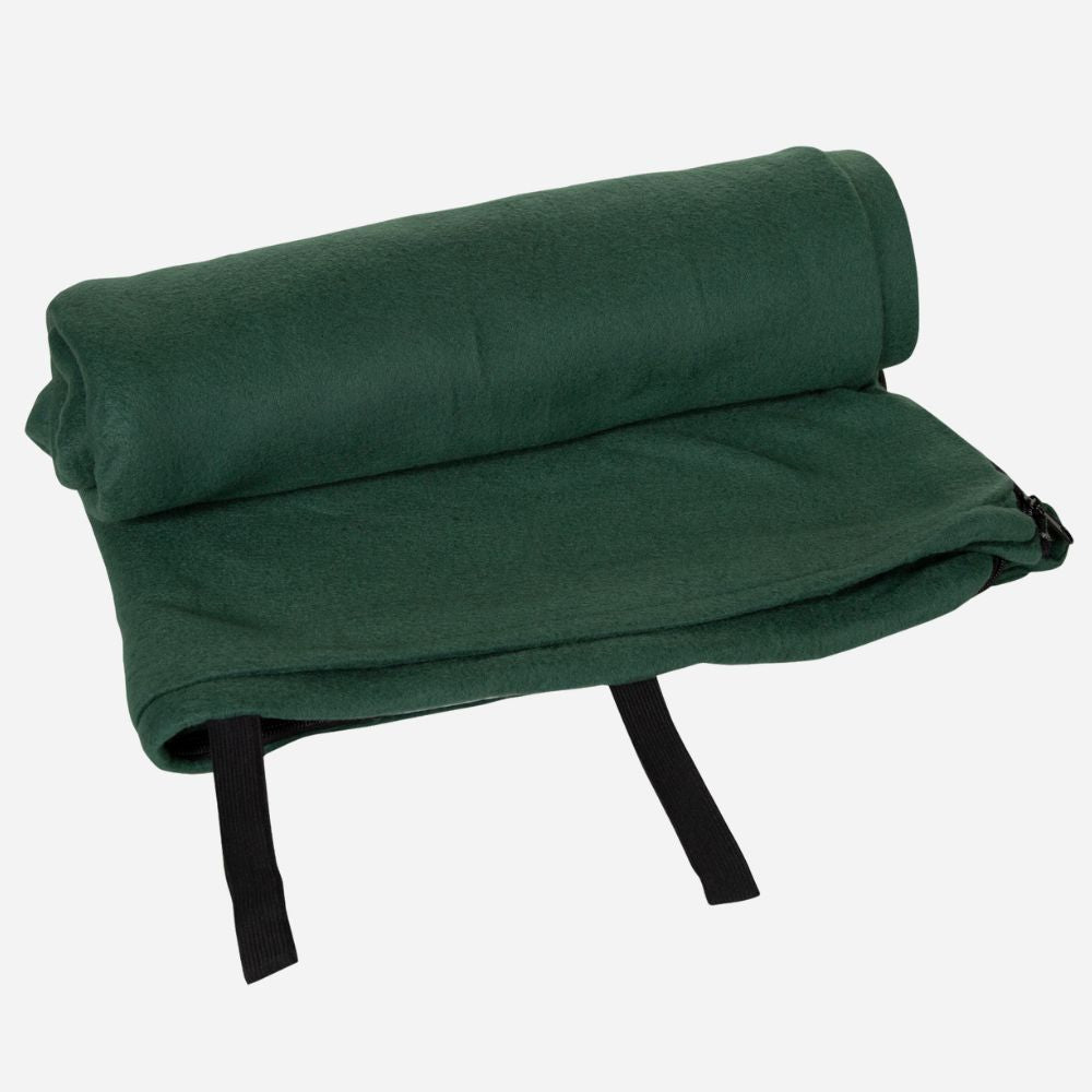 Green folded blanket with black straps on a white background