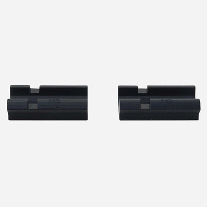 Two black rifle scope rings on a white background