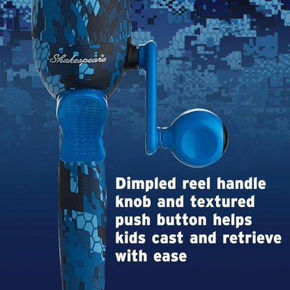 Fishing reel with dimpled reel handle knob and textured push button on a blue camouflage background.