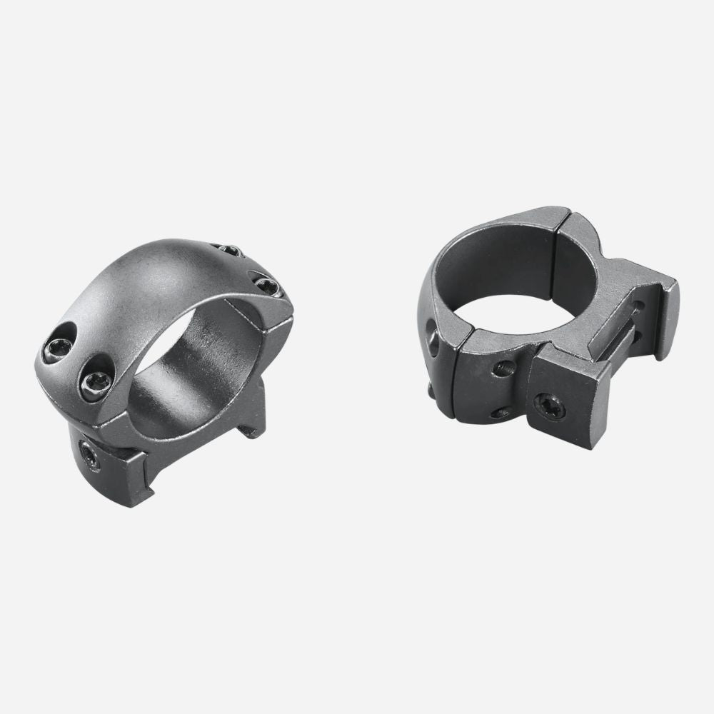 Two metallic ring components on a white background
