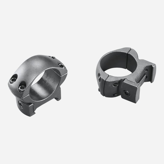 Two metallic ring components on a white background