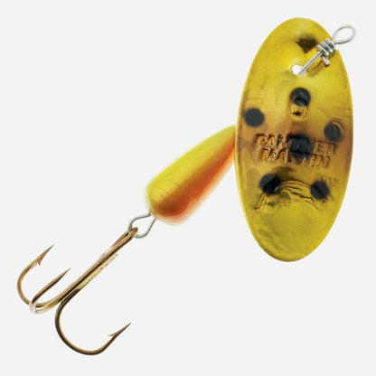 Yellow and gold fishing lure with a hook on a white background