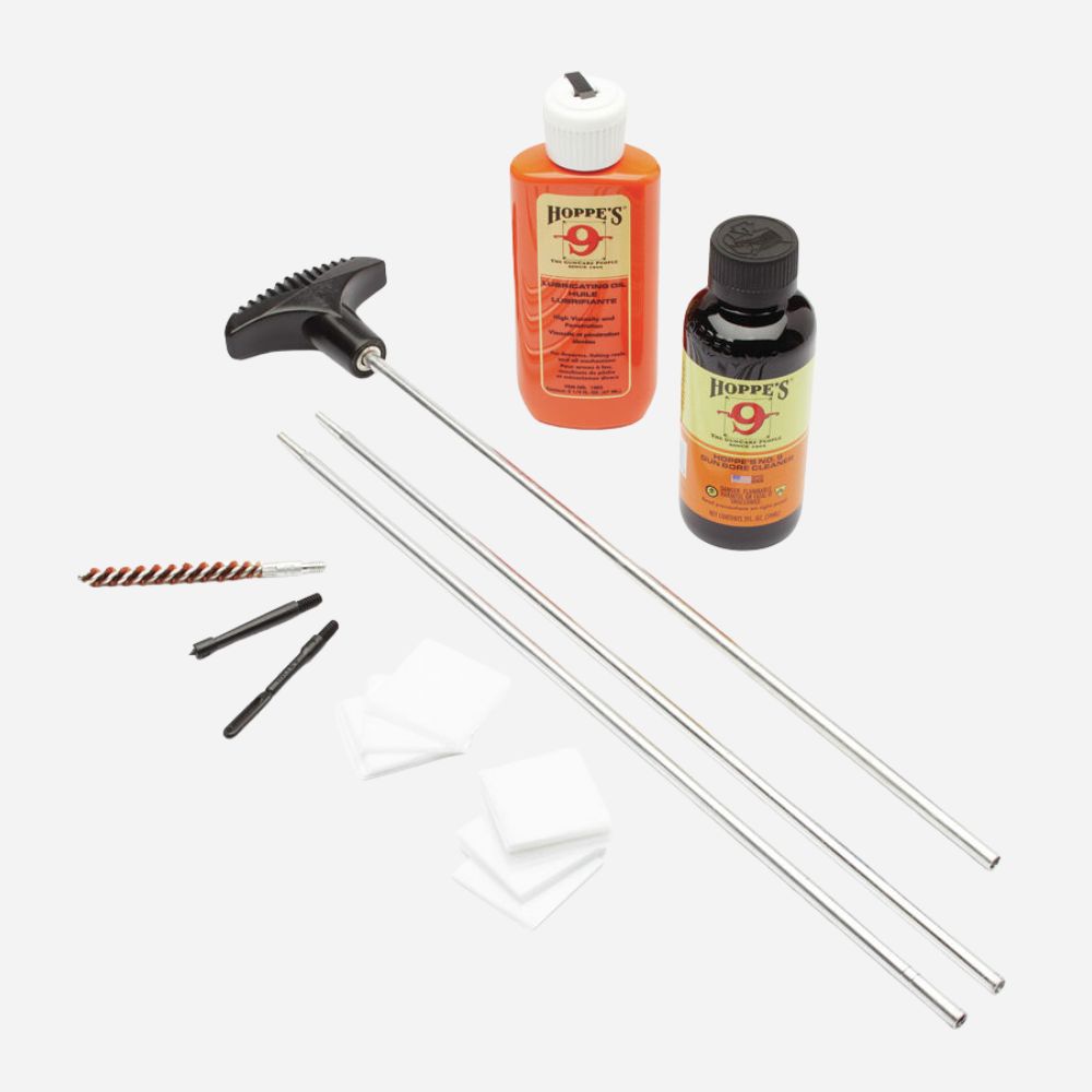 Gun cleaning kit with Hoppe's cleaning solution and tools on a white background