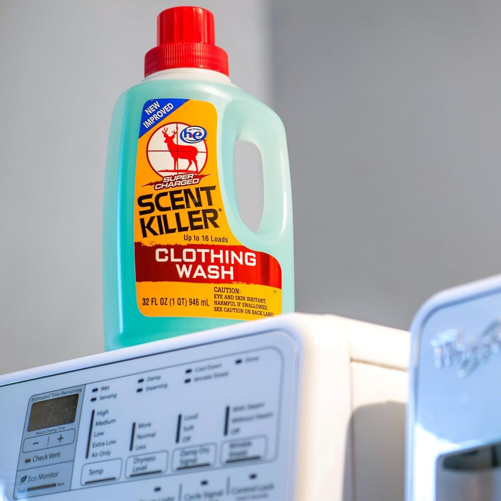 Bottle of Scent Killer Clothing Wash on a washing machine