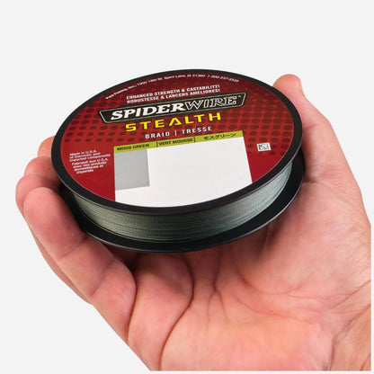 Spool of Spiderwire Stealth braid fishing line held in a hand against a white background