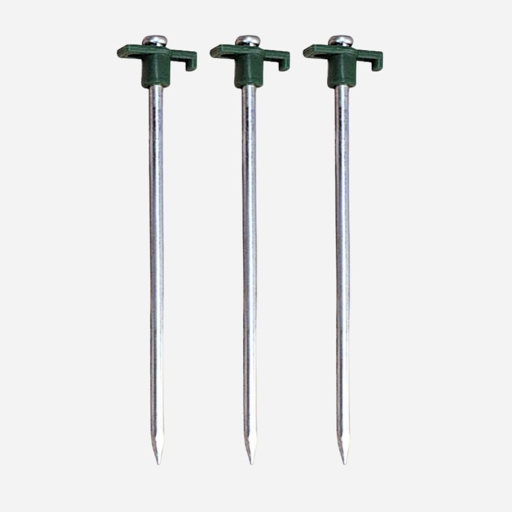 Three metal tent stakes with green plastic tips on a white background