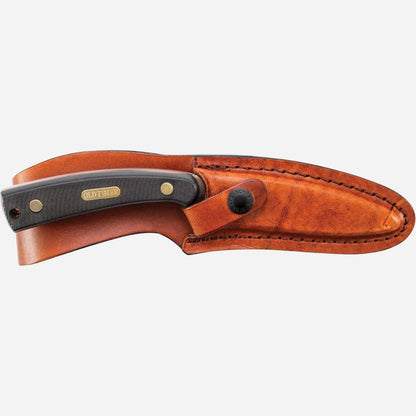Knife with leather sheath on a white background