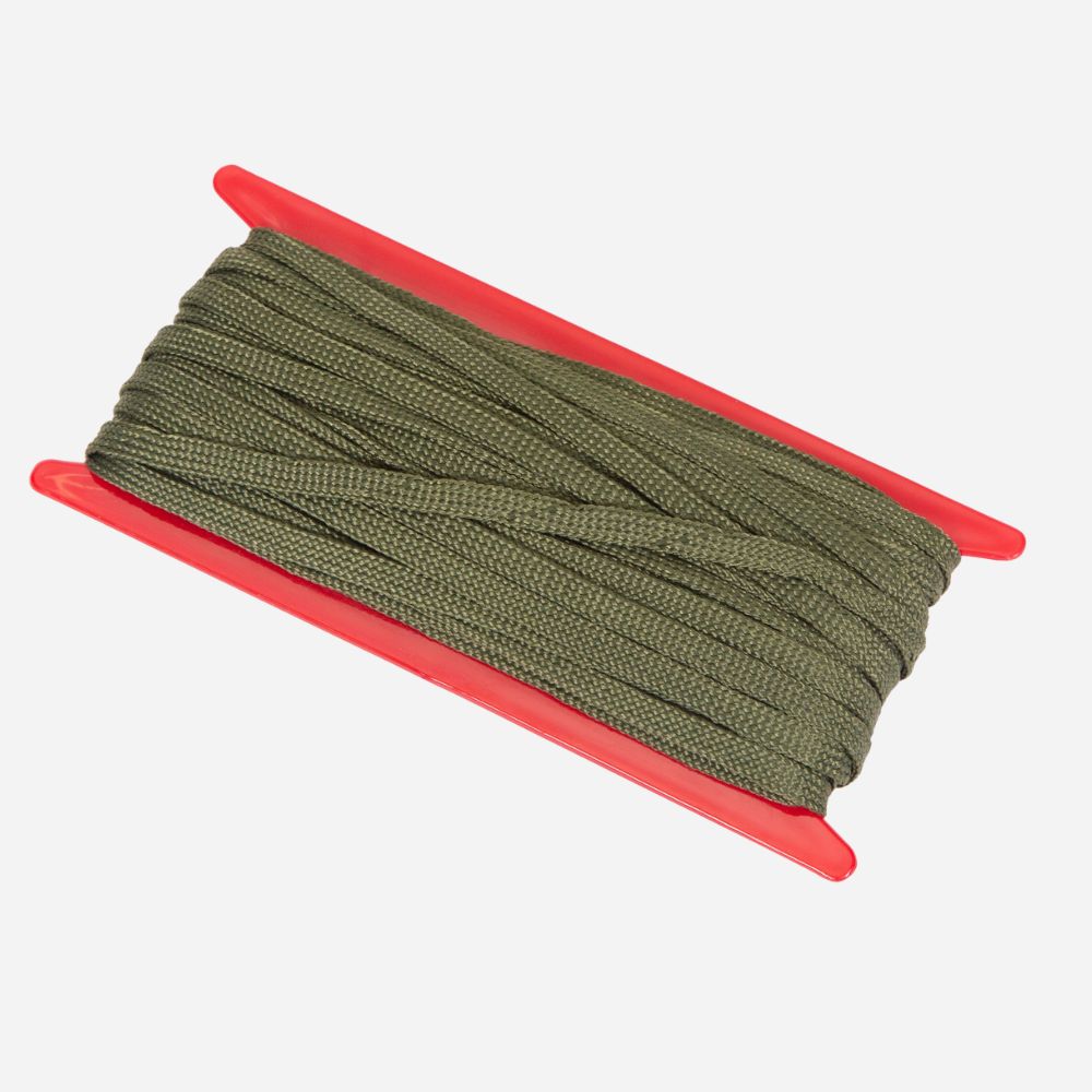 Green paracord on a red stand against a white background