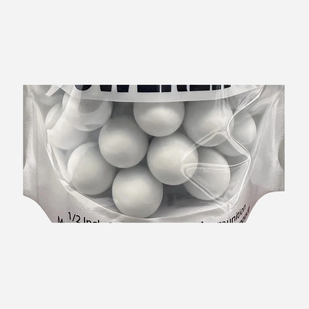 Clear plastic bag filled with white spherical objects on a white background