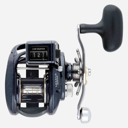 A black and silver baitcasting fishing reel with a black handle, featuring a line counter display and Lexalo branding, shown on a light gray background.