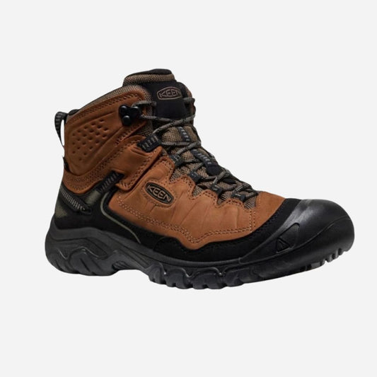 Brown and black hiking boot on a white background