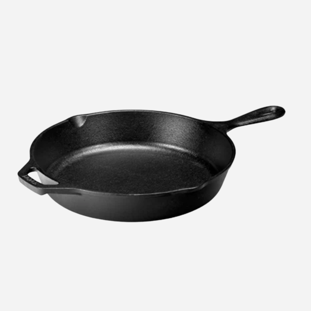 Black cast iron skillet on a white background