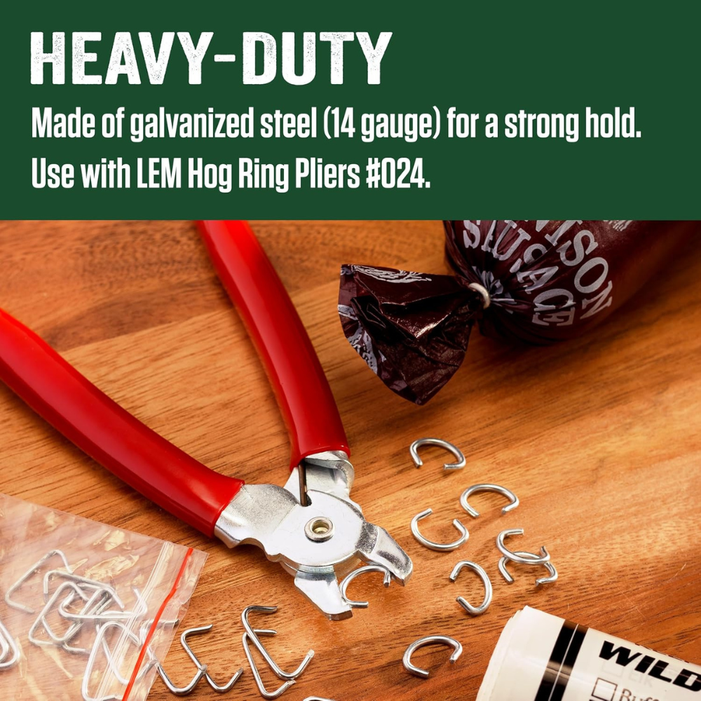 Red pliers with metal rings on a wooden surface, featuring text about material and use.