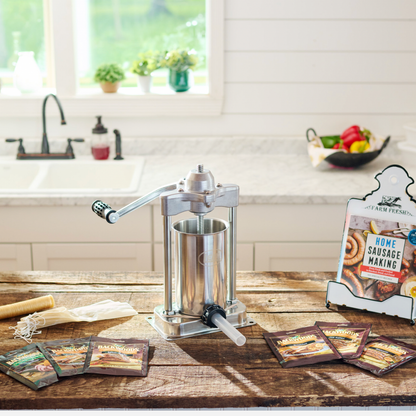 Sausage stuffer on a kitchen counter with packaging in the background