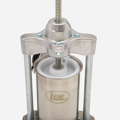 Stainless steel manual press with LEM logo on a white background