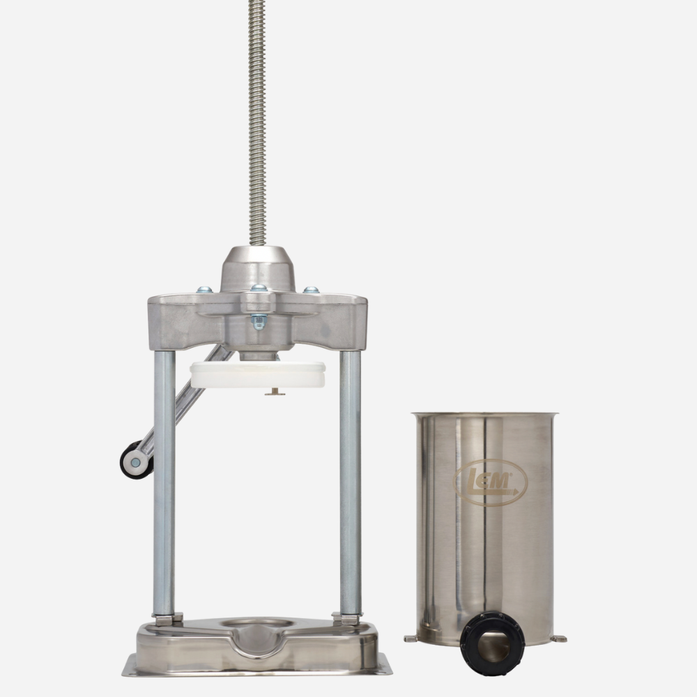 Metallic kitchen press and container on a white background