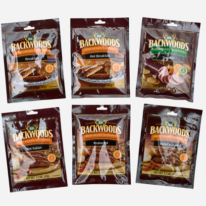Six packages of Backwoods meat product packaging on a white background