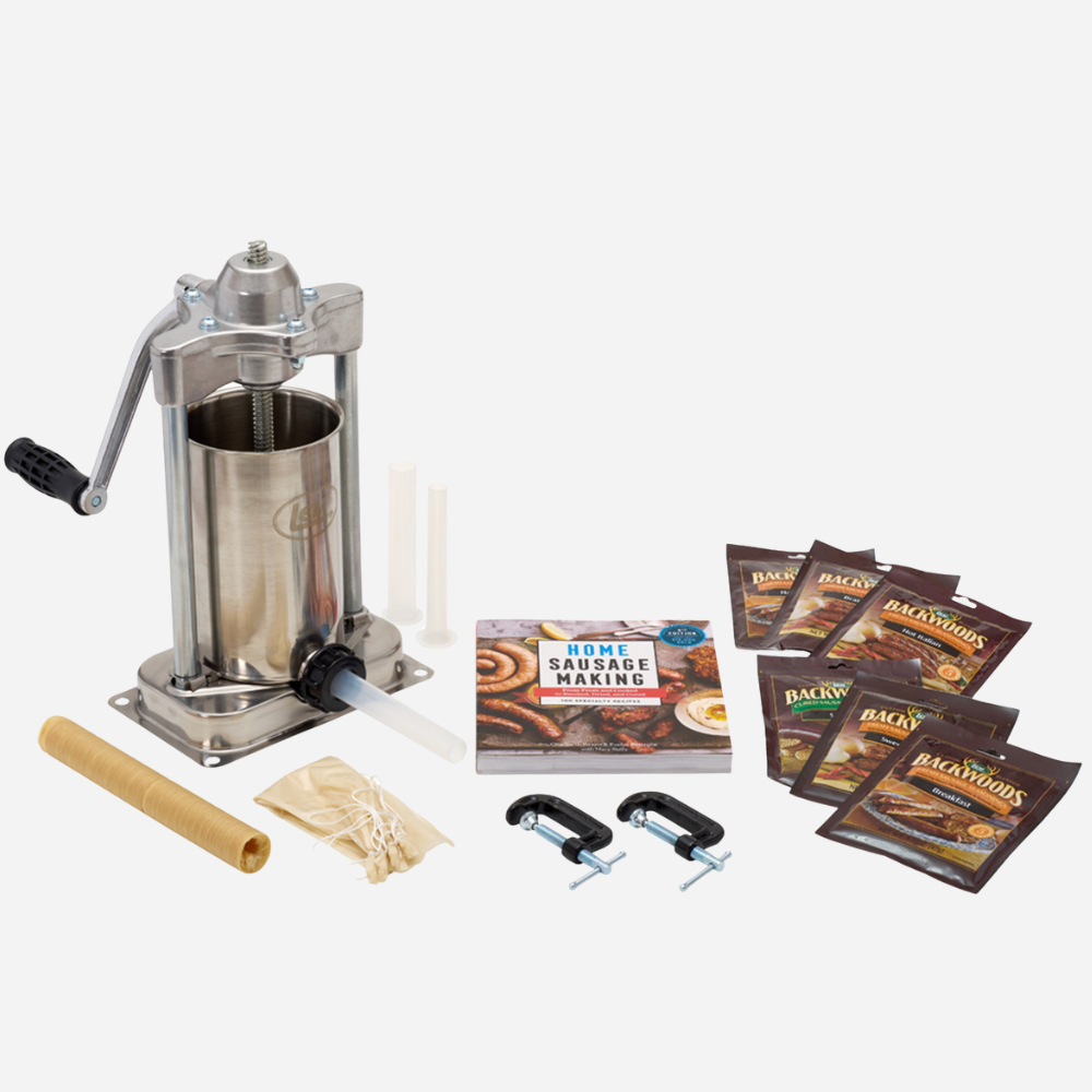 Sausage making kit with machine, links, and book on a white background