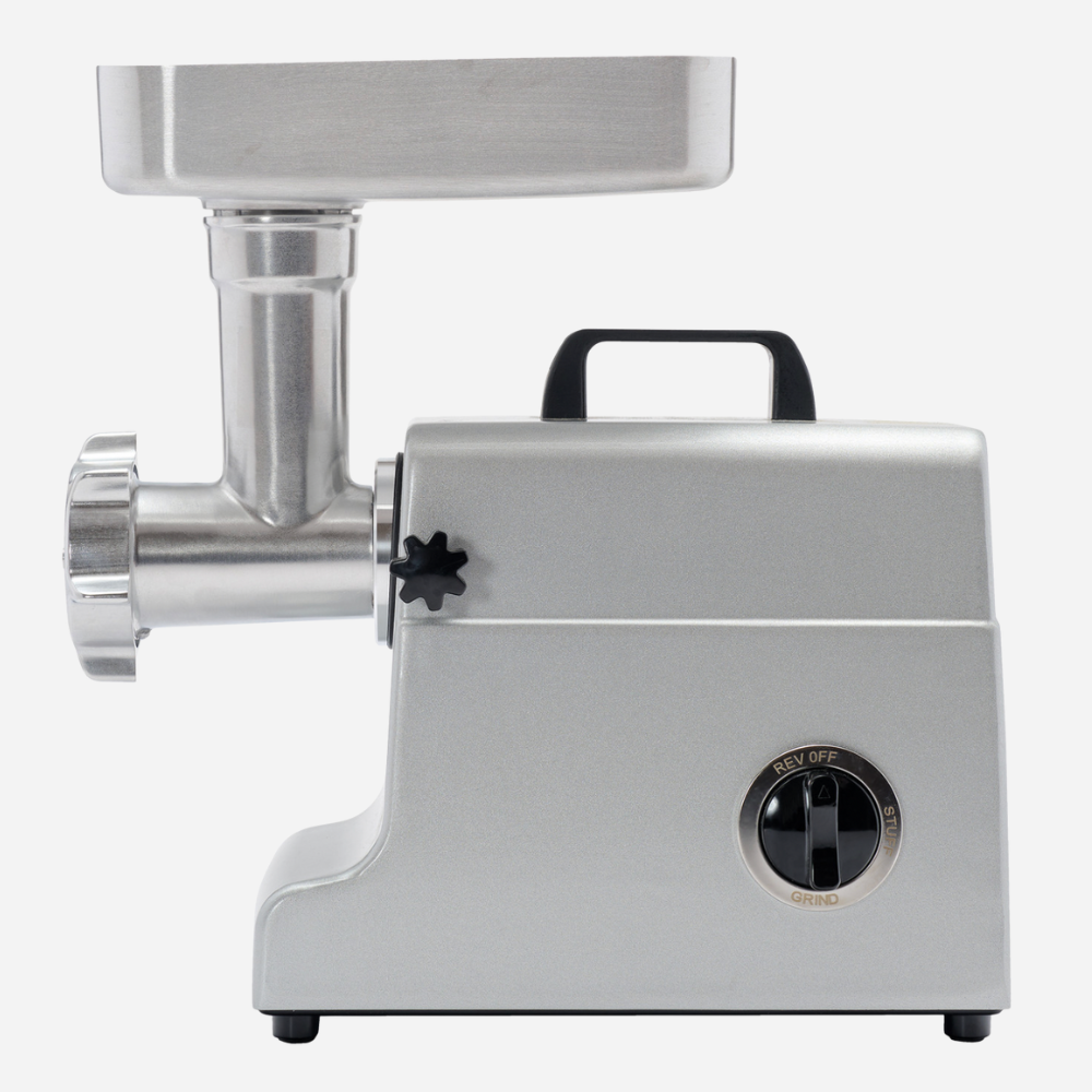 Metallic meat grinder on a white background