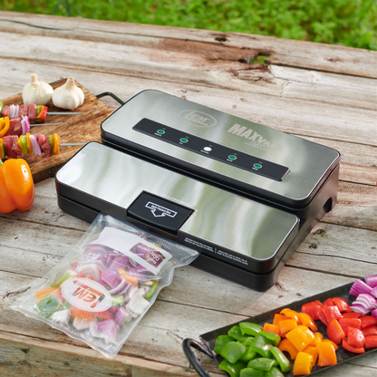 Vacuum sealer on a wooden surface with food items around
