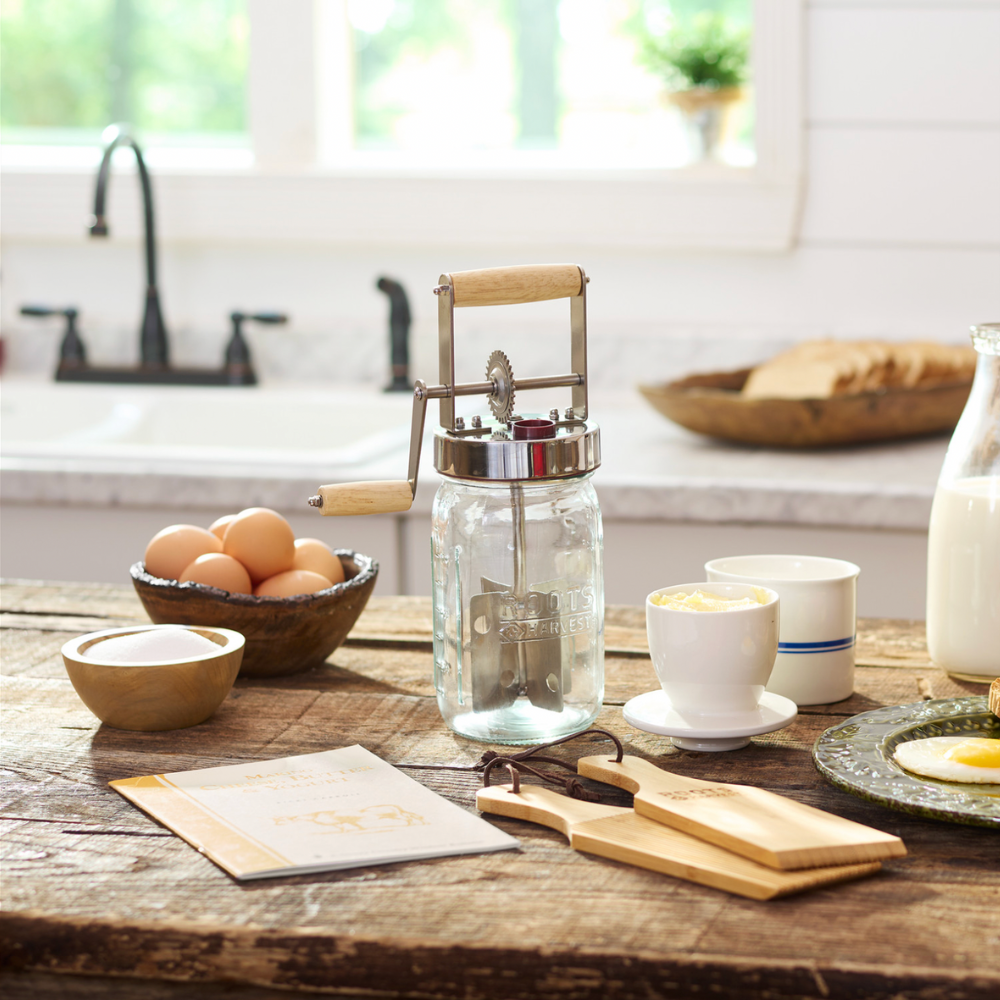Kitchen counter with a mason jar coffee press, eggs, and other items.