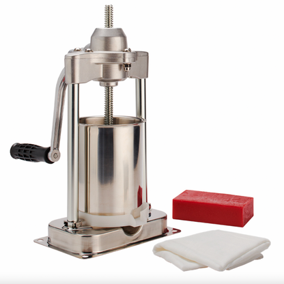 Stainless steel press with a red block and white cloth on a white background