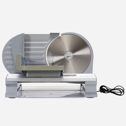 Metallic meat slicer on a white background