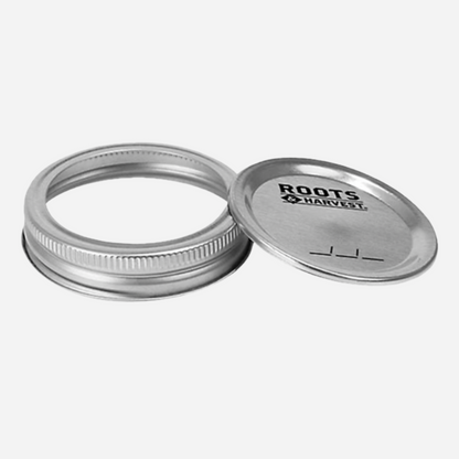 Two metal jars with 'Roots & Harvest' branding on a white background