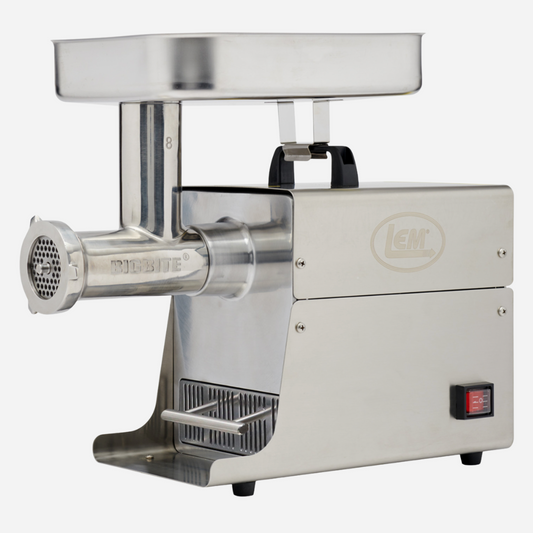 Stainless steel meat grinder on a white background