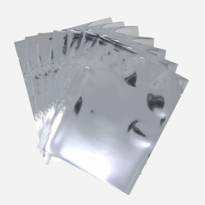 Stack of metallic foil bags on a white background