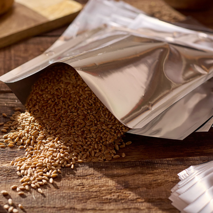 Aluminum foil packet with spilled seeds on a wooden surface