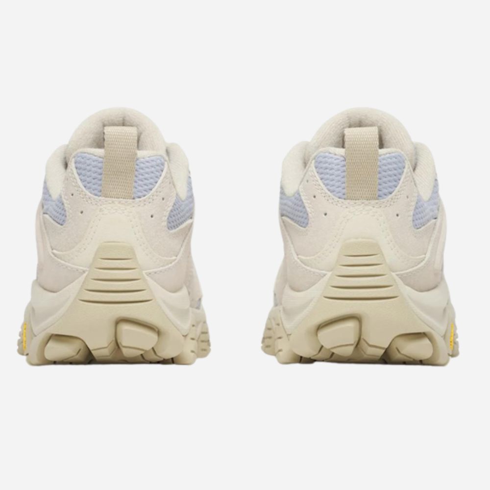 A pair of chunky platform sneakers shown from the back, featuring a thick beige platform sole, cream mesh and leather overlays, and light blue mesh panels on the sides.