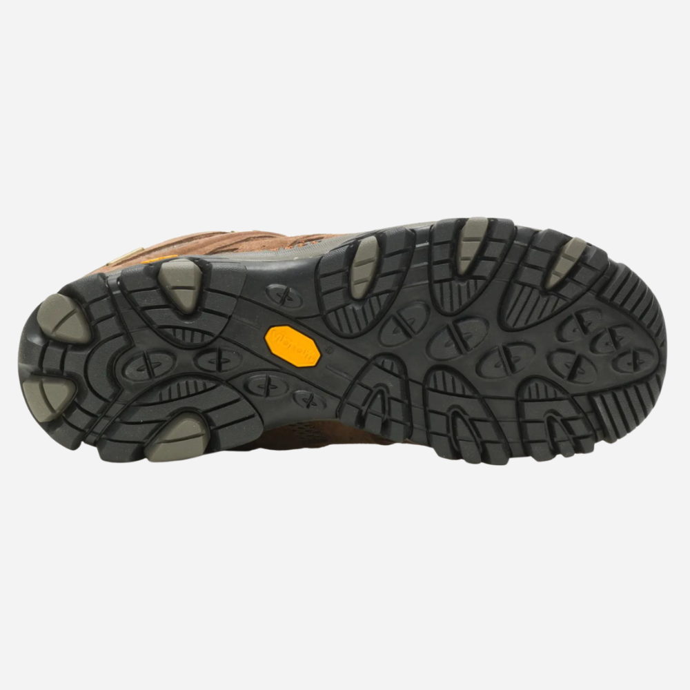 Close-up of a shoe sole with a textured pattern and orange label on a white background