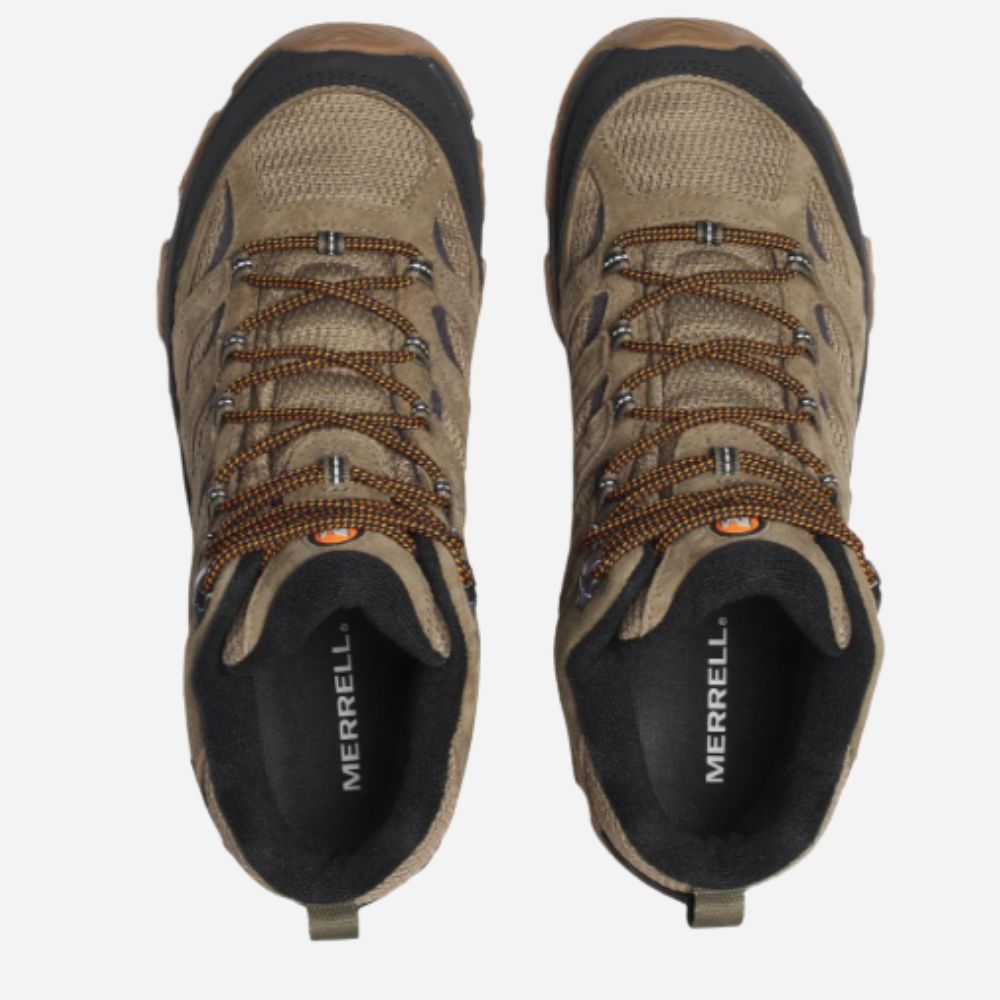 A pair of Merrell hiking boots in a tan and brown colorway, shown from a top-down view against a light gray background.
