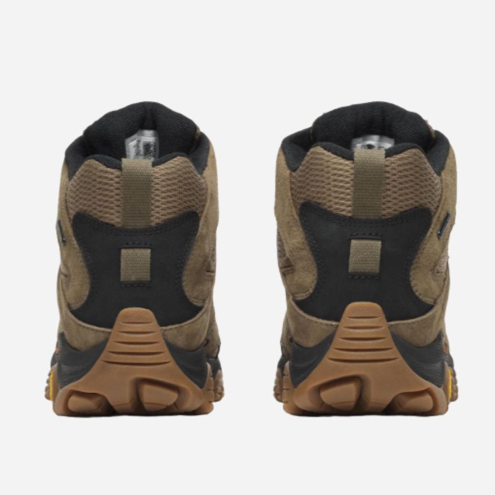 A pair of mid-height hiking boots shown from the back, featuring a color-blocked design in tan, brown, and black, with a gum-colored sole.