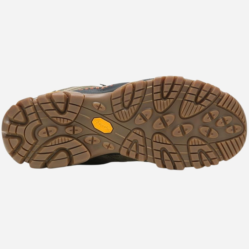 A close-up bottom view of a hiking boot's sole, showing a brown textured rubber tread with a small yellow Vibram logo on the heel, set against a light gray background.