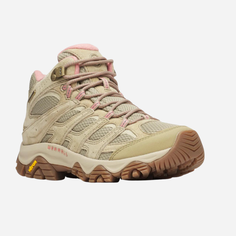 Beige hiking boot with pink laces on a white background