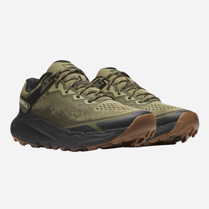 Green hiking shoes with brown soles on a white background